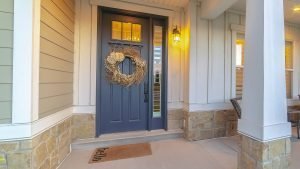 Attractive new exterior door featuring sidelight and transom windows.
