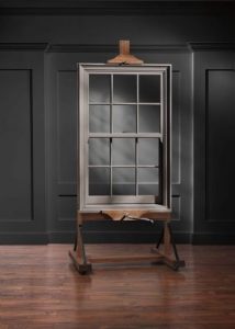 single-hung window on display in a dark room